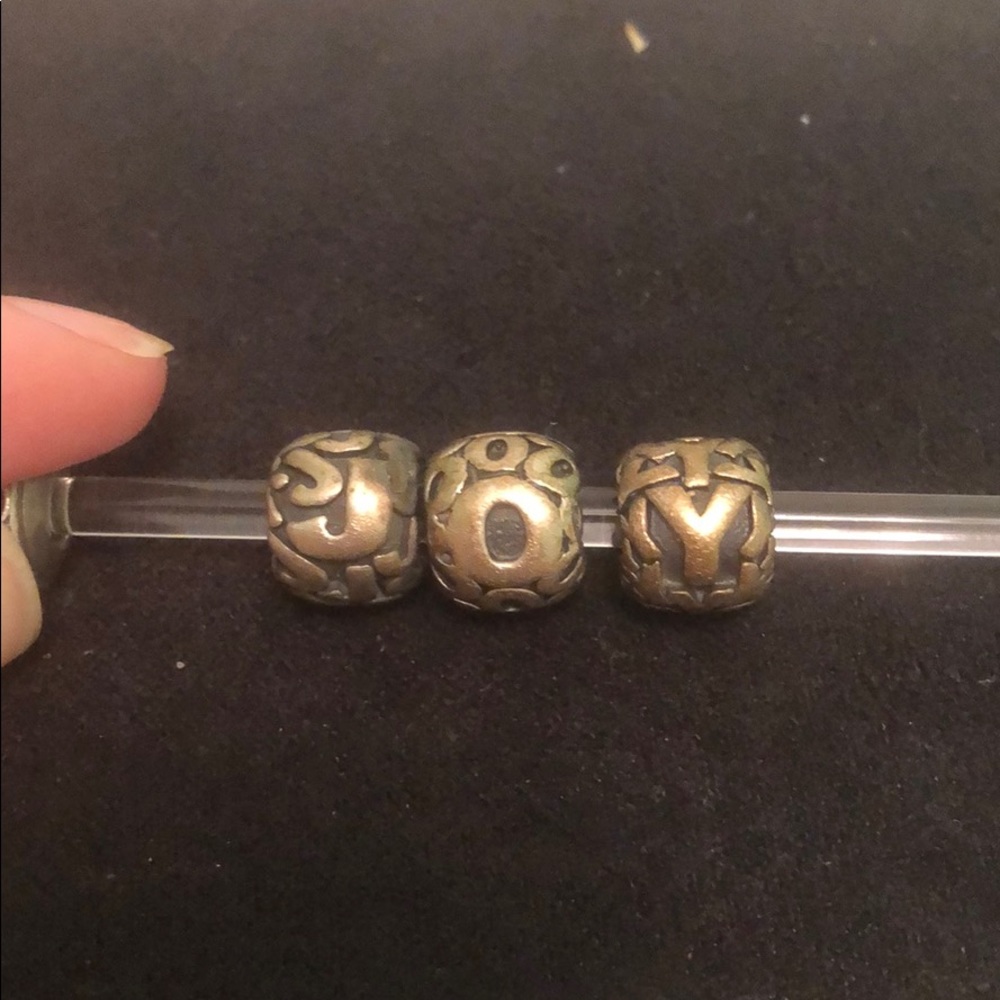 J. O. Y. charms